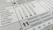 A close-up of a printed monthly calendar page showing the numbered days of the week.